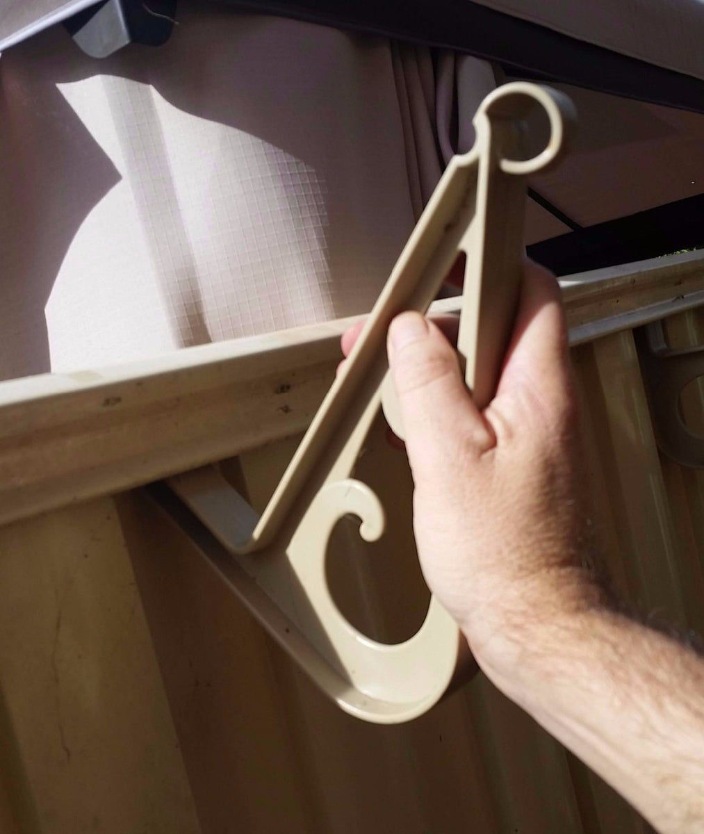 A hook that nondestructively attaches to Colorbond fences! Andihooks